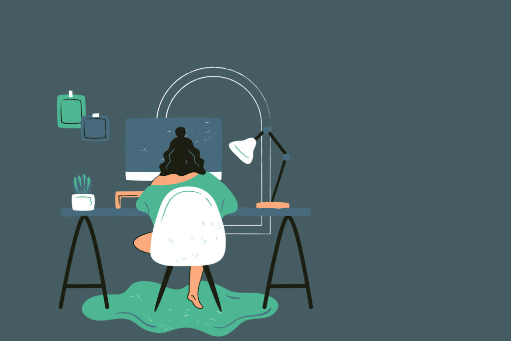Working from home at a comfortable desk with natural light, a notebook, coffee, and a laptop