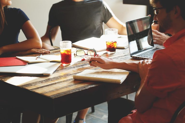 how to reduce meetings represented by an empty meeting room replaced with a clear written handoff and focused work time