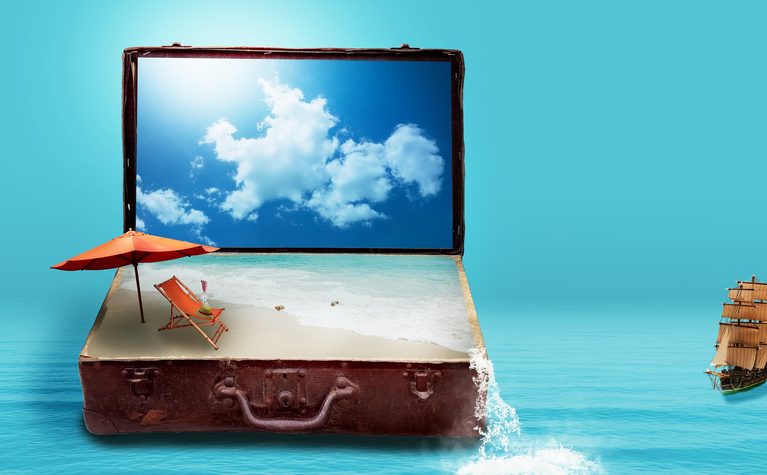 remote work abroad checklist represented by travel essentials, backup internet, documents, and work gear packed together